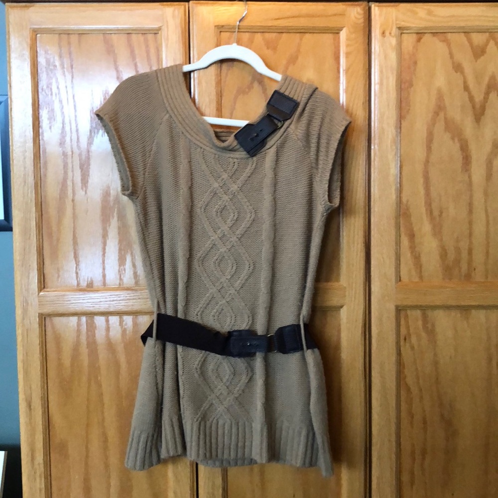 Light brown sleeveless sweater.